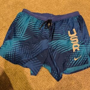 Nike Blue Athletic Shorts with Gold Accents